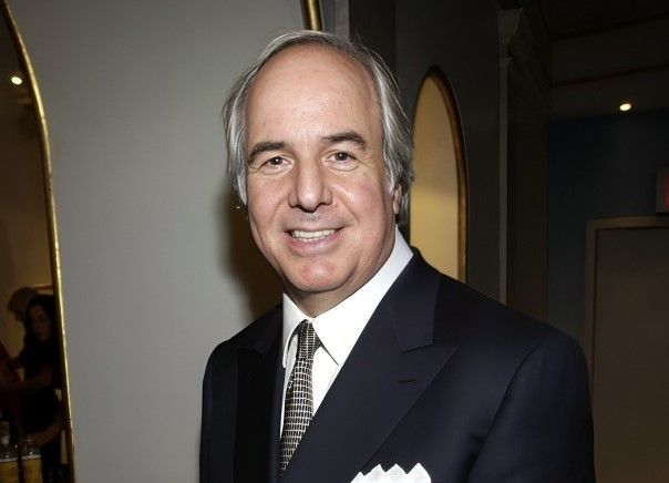 Frank Abagnale standing in a black suit.