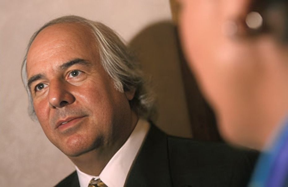 Frank Abagnale standing with another man.