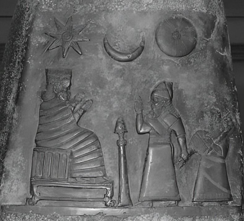 Ancient Babylonian bas-relief showing a king and a priest, with celestial bodies above.
