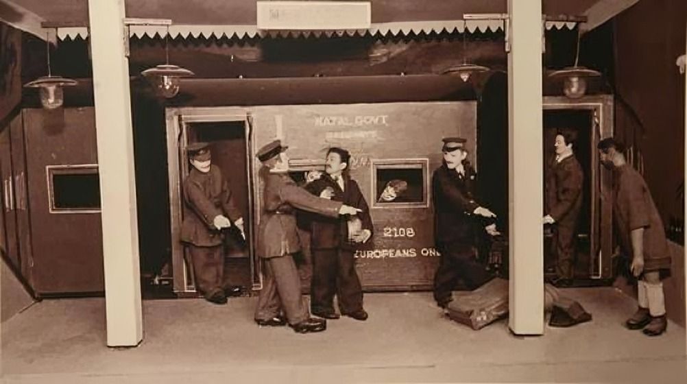 Reenactment of Mahatma Gandhi's ejection from a train compartment marked 'Europeans Only'.