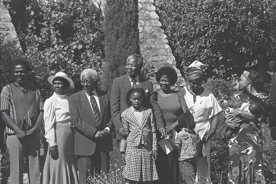 Image featuring Walter Sisulu, Nelson Mandela, Winnie Mandela, Albertina Sisulu, and the Mandela family.