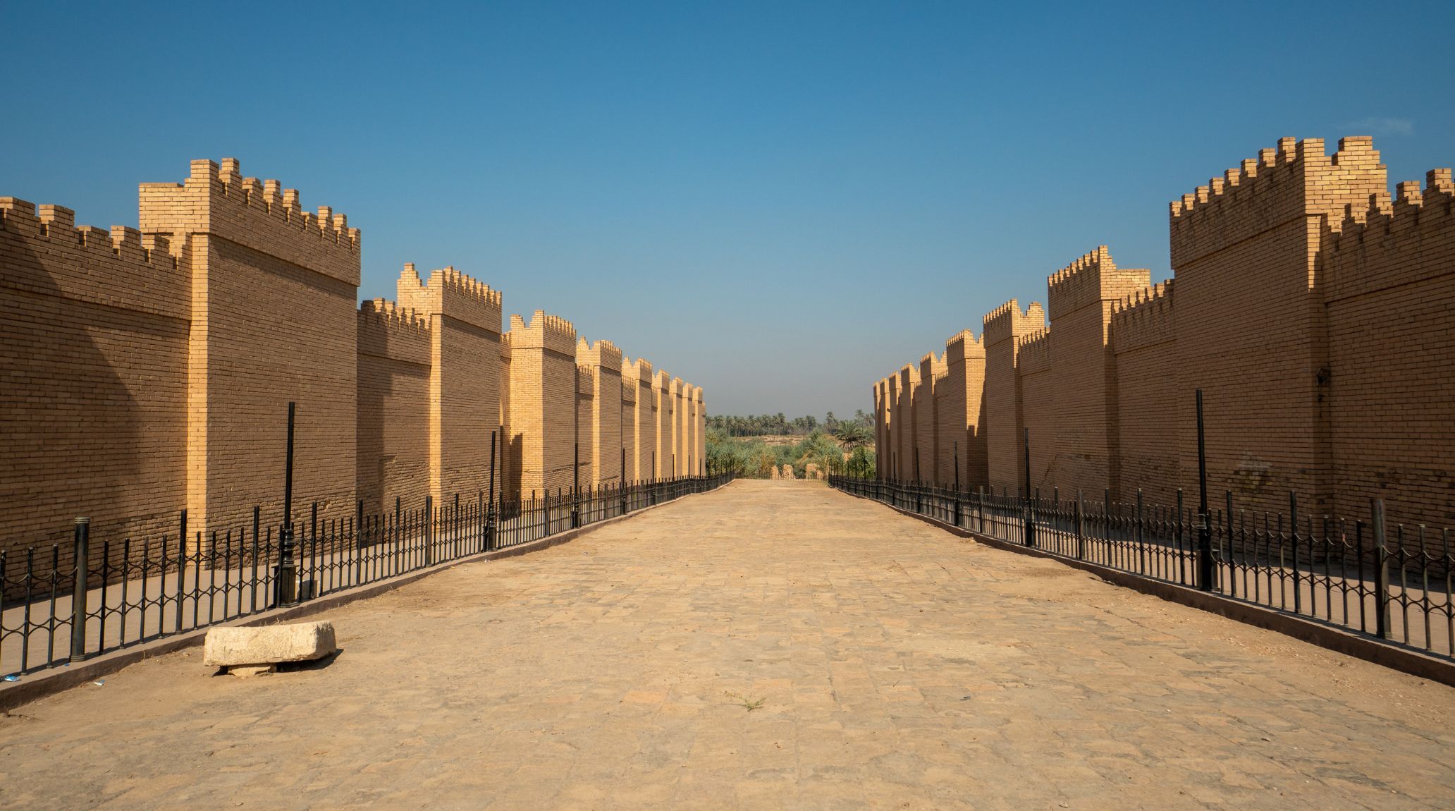Ancient Babylonian Ishtar Gate, long street, and city walls.