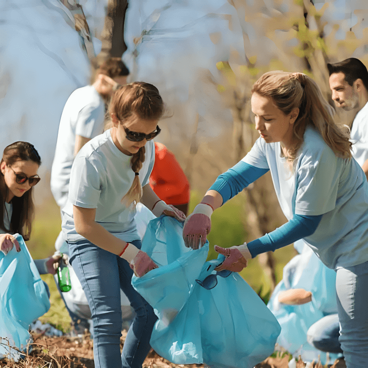 Volunteers cleaning up trash outdoors in a group.