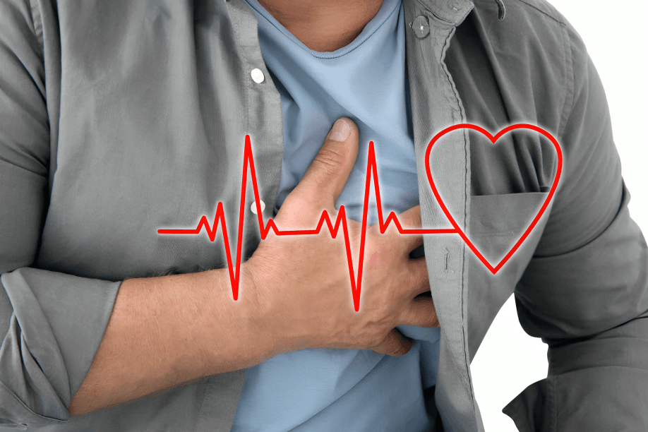 Man clutching chest with heart and EKG overlay.
