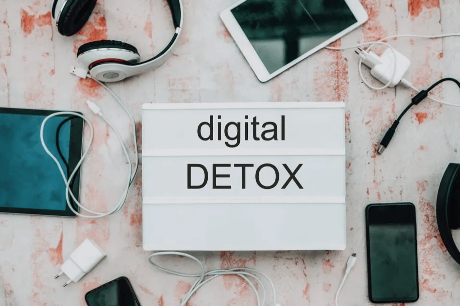 "Digital Detox" lightbox surrounded by disconnected devices.