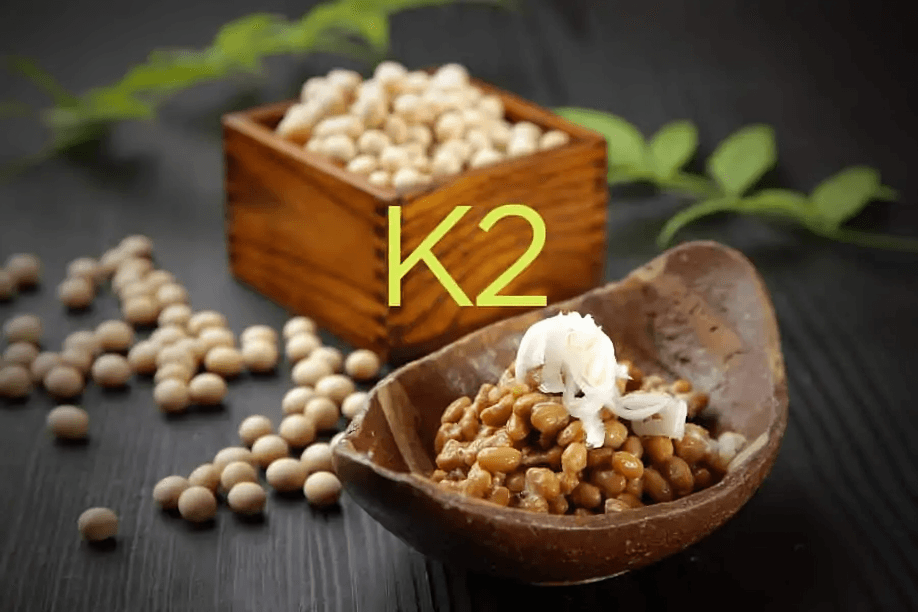 A bowl of natto and soybeans with "K2" text.