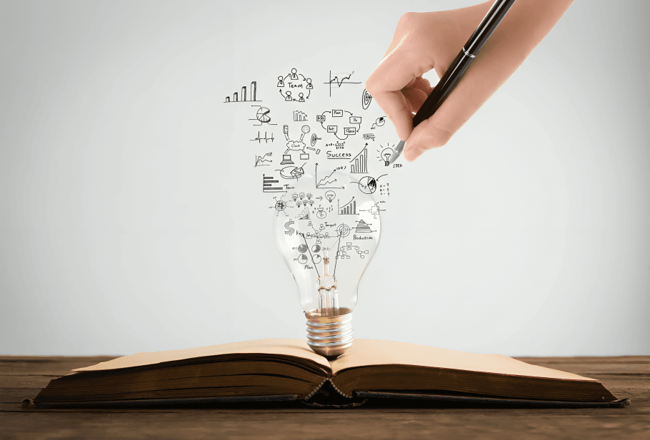 Hand-drawing ideas flowing from a book into a bulb.