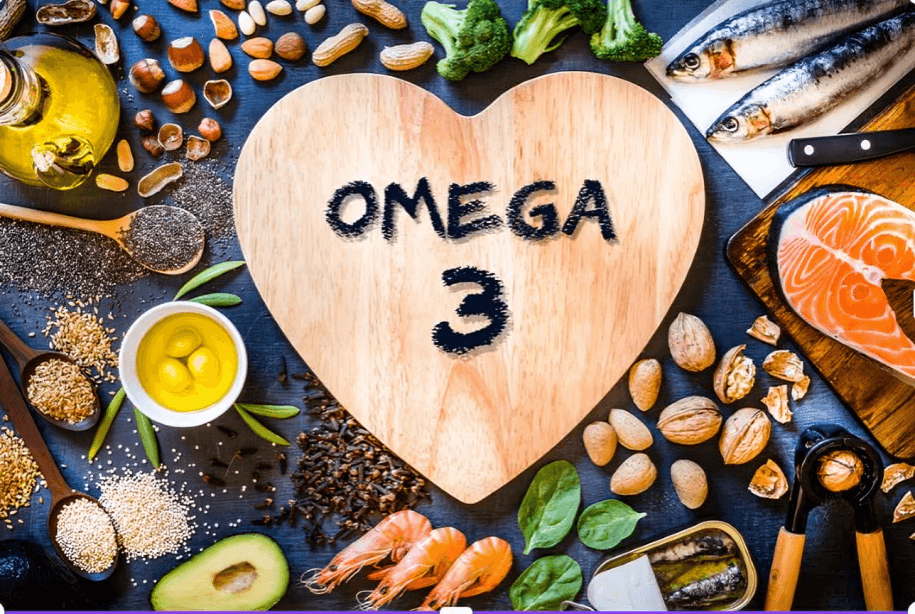 "Omega 3" on a heart-shaped board with foods.