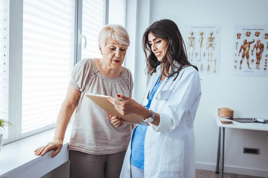 A doctor showing a patient a medical chart.