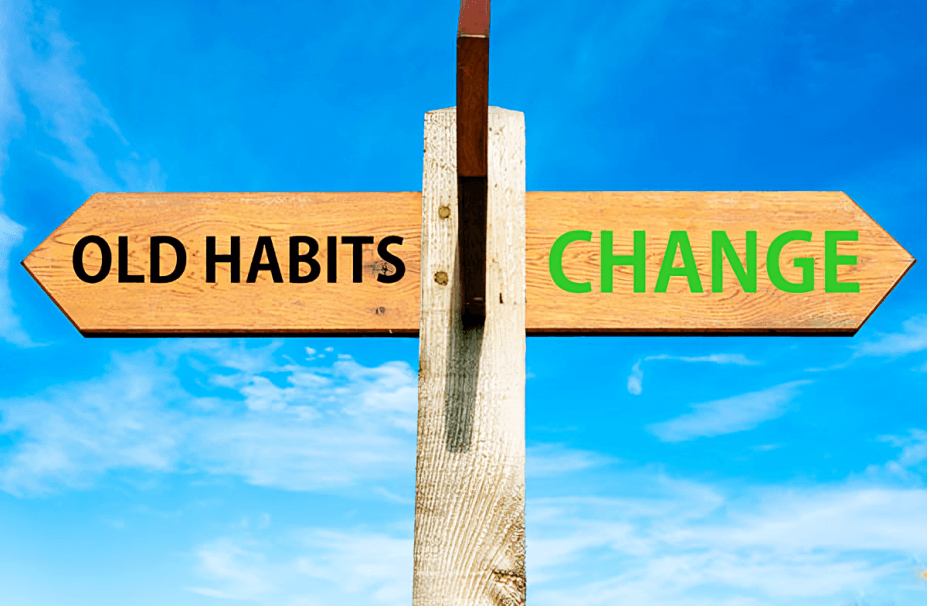 Directional signpost showing "Old Habits" versus "Change."