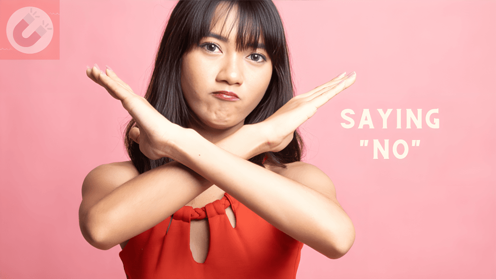 Young woman, possibly Asian, crossing arms, "Saying 'No'".