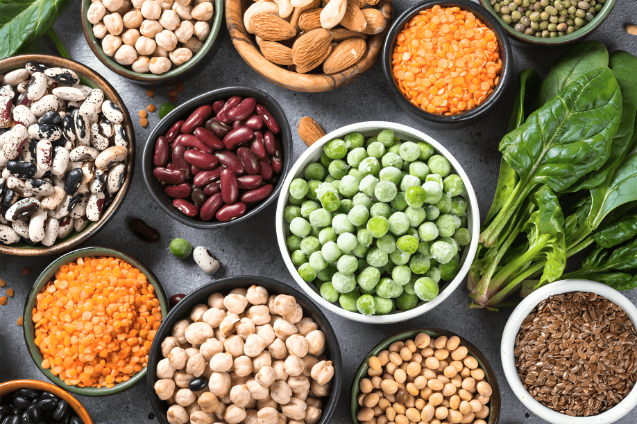 An assortment of fresh green fruits and vegetables.