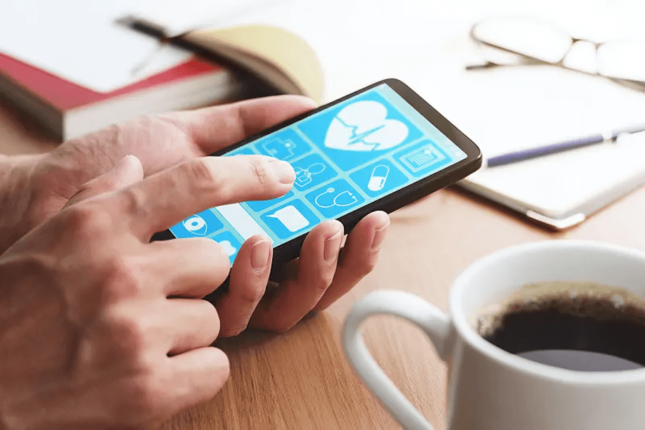Close-up of hands using a health app on a smartphone.