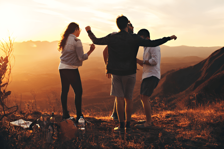 Group of friends enjoying sunset view.