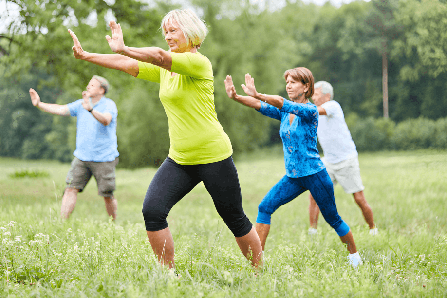 Seniors practicing Tai Chi in a park.