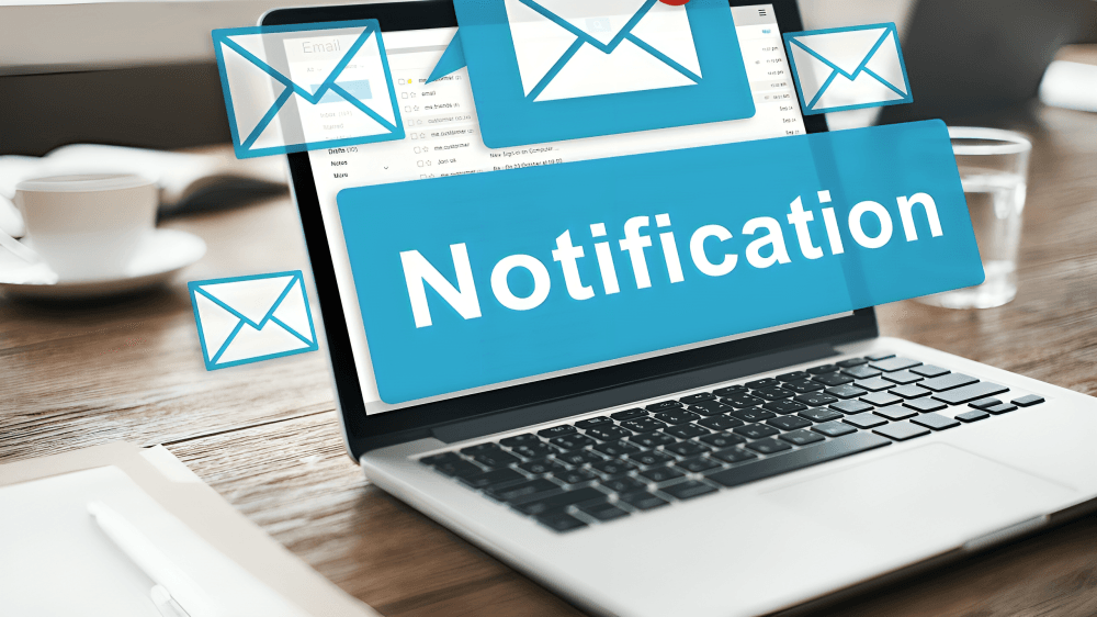 Laptop showing email notifications and a "Notification" banner.