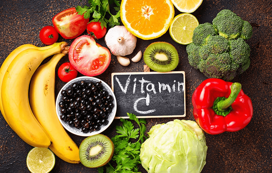 Vitamin C-rich foods flat lay with fruits and vegetables.