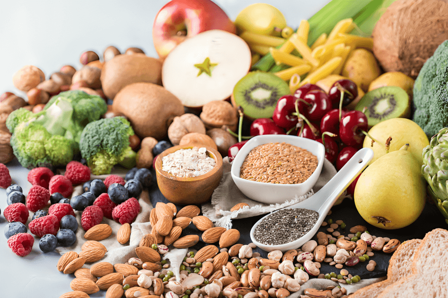 Close-up of various high-fiber foods, fruits, nuts, grains.