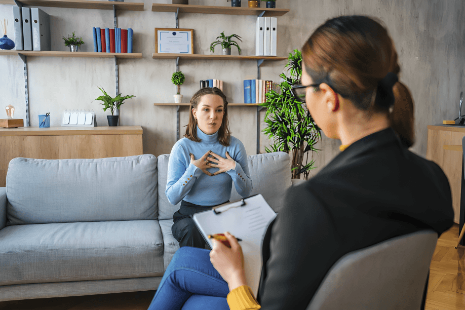 Woman in therapy session discussing her feelings with therapist.