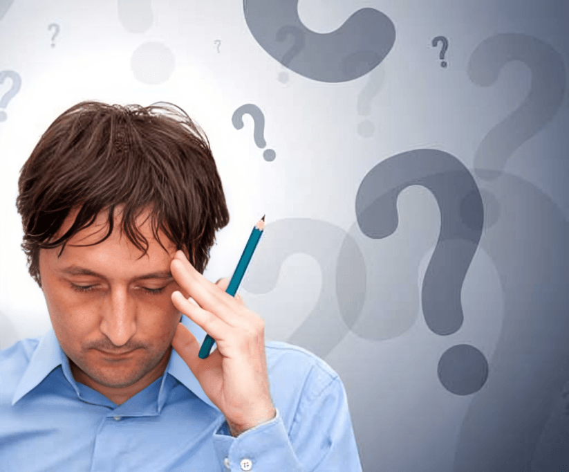 Man with hand on head, surrounded by question marks.