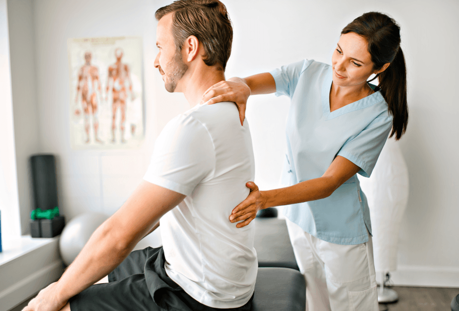 A man receiving physiotherapy for back and shoulder pain.