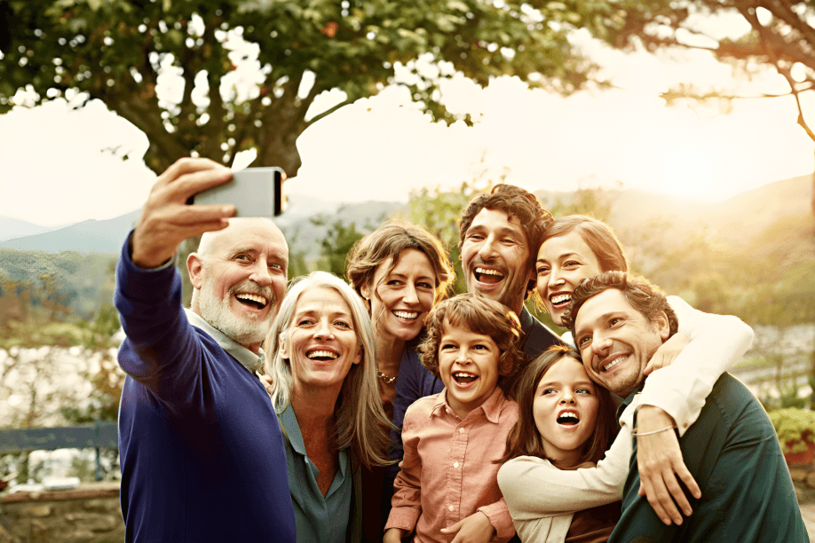 A large, seemingly happy family taking a selfie outdoors.
